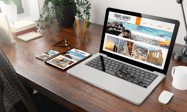 istock devices travel agency on wooden desktop 1127330529