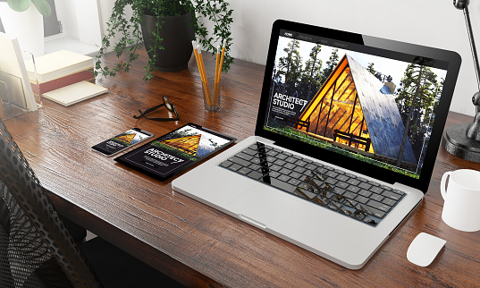 devices architect studio on wooden desktop 3d rendering