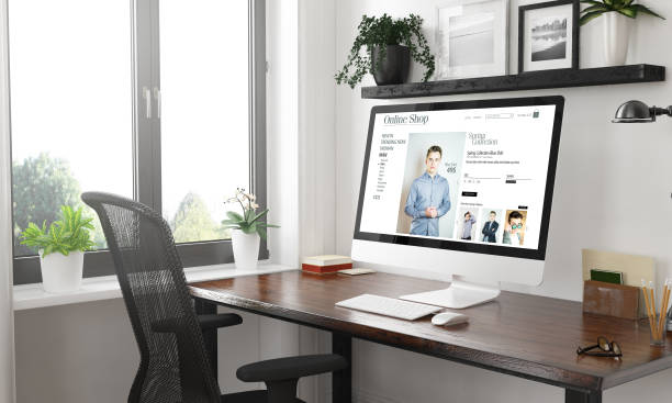 istock black and white online shopping clothes computer on desktop 1127330608
