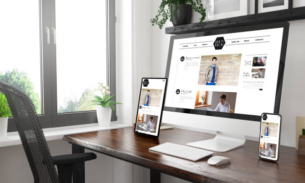 istock black and white desktop with three devices showing blog 1127330627