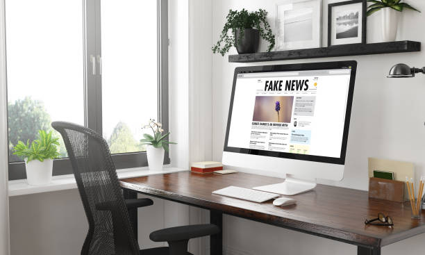 istock black and white fake news computer on desktop 1127330634
