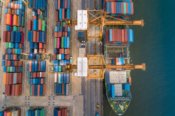 istock Logistics and transportation of Container Cargo ship and Cargo working crane bridge in shipyard 1127332135