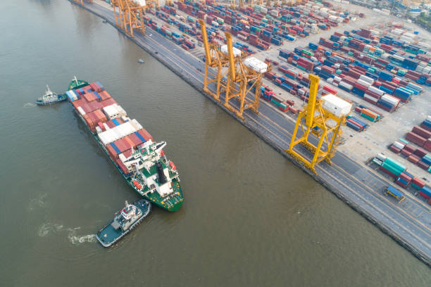 istock Logistics and transportation of Container Cargo ship and Cargo working crane bridge in shipyard 1127332158