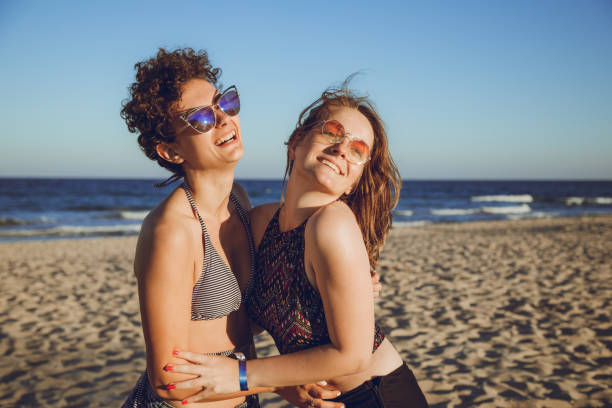 istock Female couple on the beach 1127333298