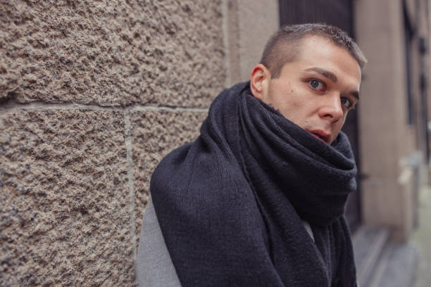 istock Man with black scarf portrait 1127338173