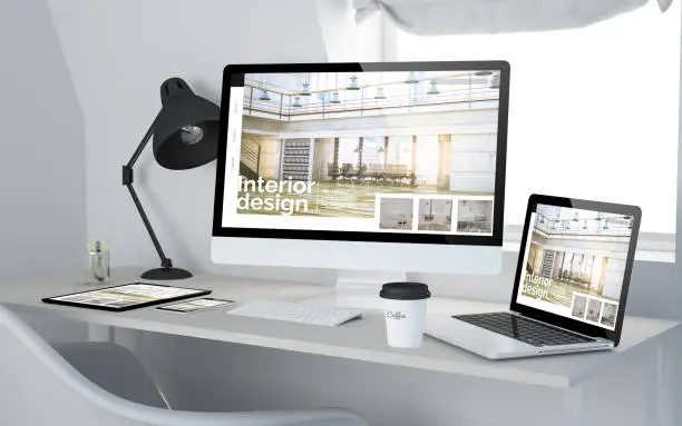 3d rendering of workroom with responsive devices showing interior design website on screen. All screen graphics are made up.