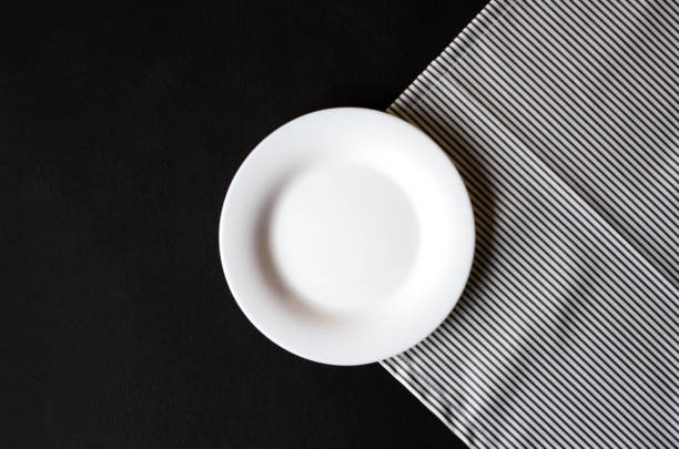 istock Empty plate for your dishes on a wooden background. 1127339171
