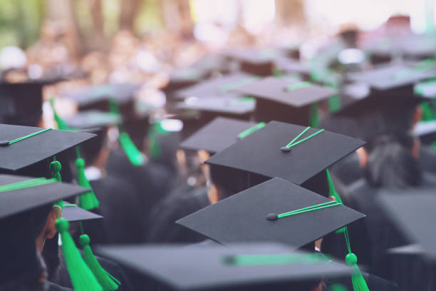 istock Group of Graduates during commencement. Concept education congratulation in University. Graduation Ceremony in University during commencement. close up hat. 1127339752