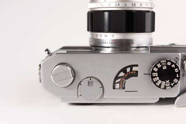 istock Old photo camera isolated on white background 1127341486