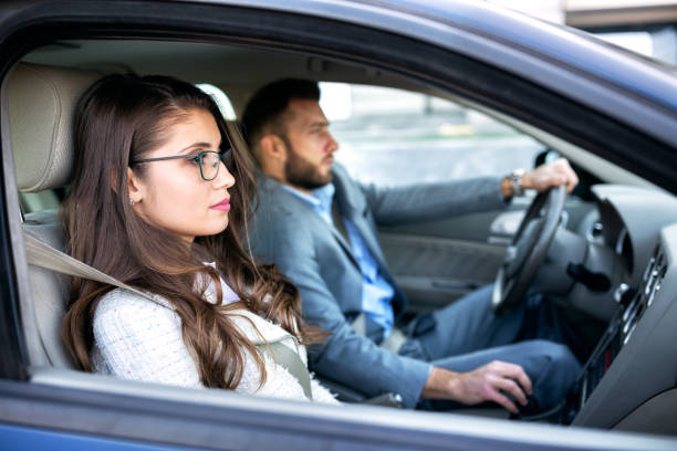 istock Guy in the suit driving his coworker 1127345260