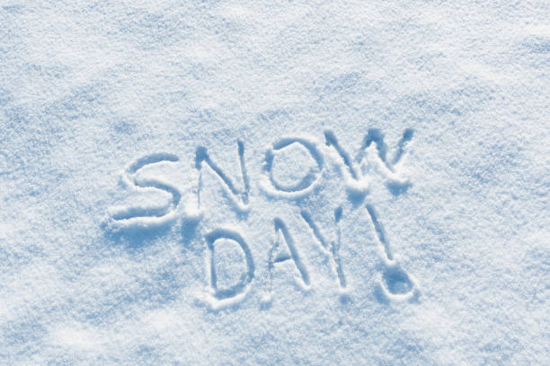 Somebody wrote “SNOW DAY!” in the freshly fallen snow on a cold Winter morning. Meaning schools and or work places are closed because of the dangerous conditions for people to travel.