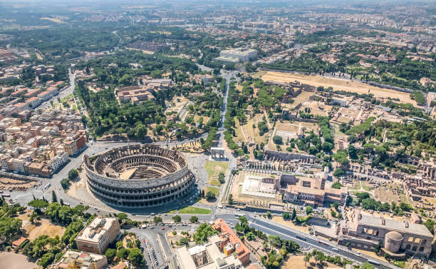 an impressive aerial view of the historic heart of ancient rome with the coliseum and the roman forum - rome cityscape aerial view city imagens e fotografias de stock