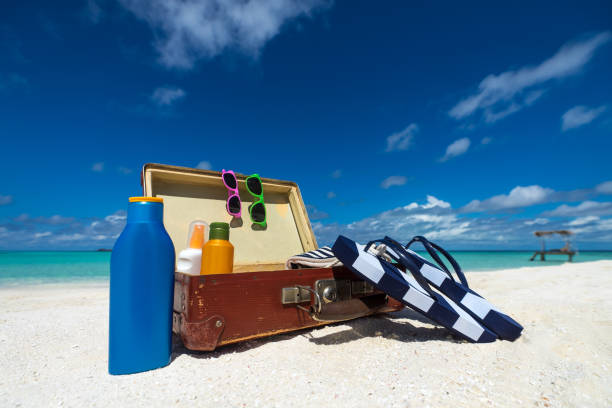 istock Beach Accessories In Suitcase On Beach - Travel Concept 1127346379