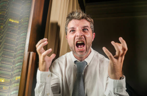 istock crazy stressed and desperate business man screaming sick suffering stress feeling overworked and overwhelmed working at company office job late at night in businessman lifestyle concept 1127346609