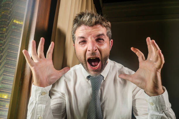 istock crazy stressed and desperate business man screaming sick suffering stress feeling overworked and overwhelmed working at company office job late at night in businessman lifestyle concept 1127346615