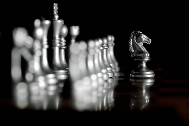 istock Pieces on chess board for playing game and strategy knight kingdom 1127347770