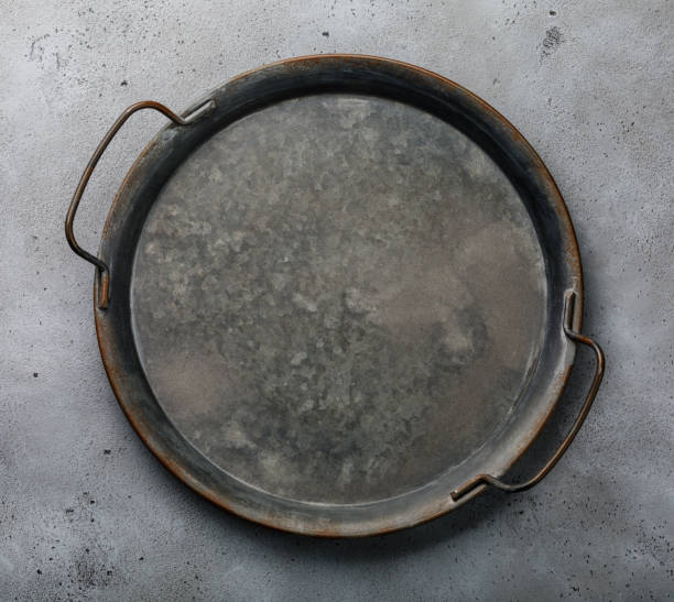 istock Vintage metal tray on concrete background copy space 1127347790