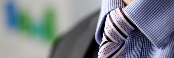 istock Business man in black suit set tie closeup 1127351251