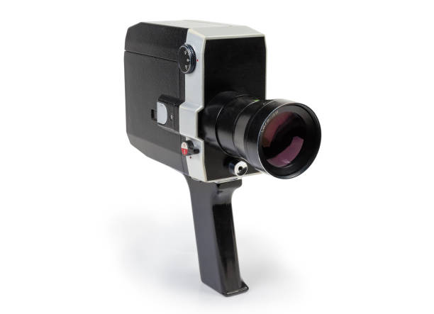 Super 8mm amateur mechanical movie camera on a white background Old amateur film movie camera Super 8mm format powered by clockwork motor on a white background vintage amateur movie camera stock pictures, royalty-free photos & images