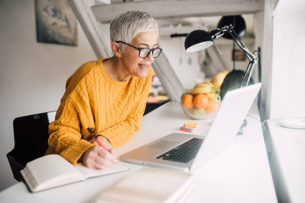 istock Senior woman working on laptop 1127353952