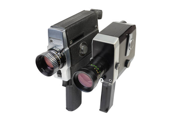Vintage amateur mechanical and electric movie cameras on white background Two old vintage amateur film movie cameras Super 8mm format powered by clockwork motor and electric motor on a white background vintage amateur movie camera stock pictures, royalty-free photos & images