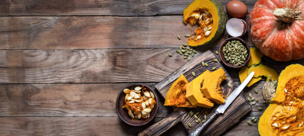 istock pumpkin pie cooking process on wooden background 1127354900
