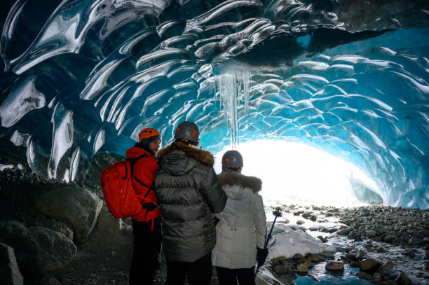 istock Guided tour in a majestic ice cave 1127356576