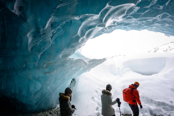 istock Guided tour in a majestic ice cave 1127356606
