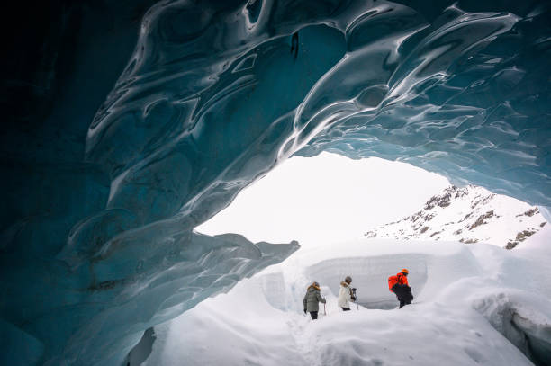 istock Guided tour in a majestic ice cave 1127356608