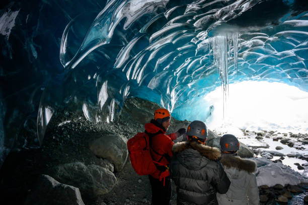 istock Guided tour in a majestic ice cave 1127356848