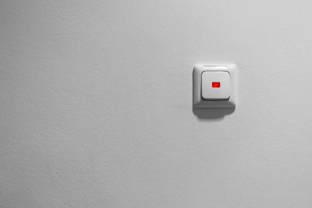 Light switch on a gray wall Light switch on a gray wall büro stock pictures, royalty-free photos & images