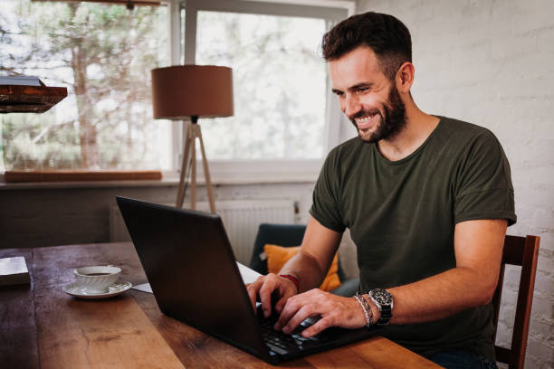 istock Young casual man working on a laptop 1127357204