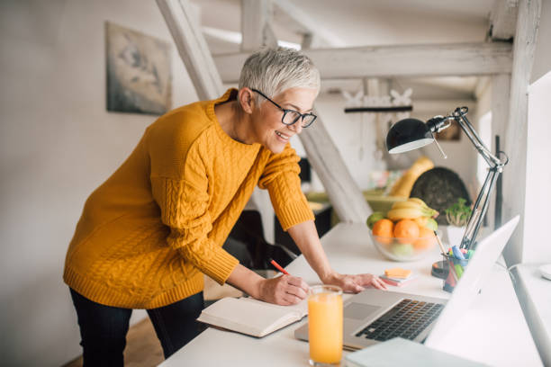 istock Mature woman working at home 1127358471