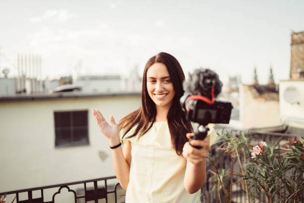 istock Smiling woman vlogging from Budapest 1127358773
