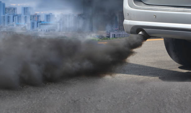 air pollution crisis in city from diesel vehicle exhaust pipe on road - air vehicle fotos imagens e fotografias de stock