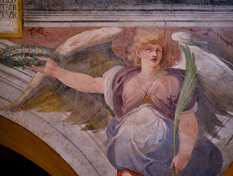 Rome, Italy - February 4, 2019: Close-up of angel from the Basilica of Santi Nereo and Achilleo in Rome, famous for its XVI century frescos.