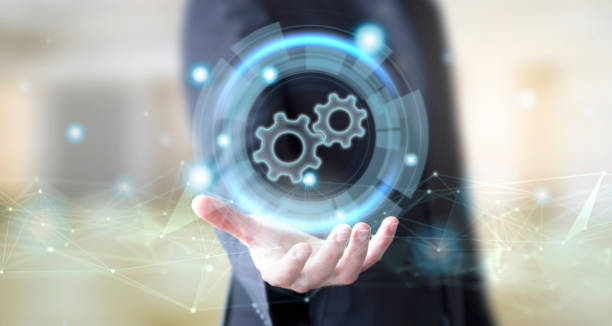 istock businessman with digital gears icon 1127361758