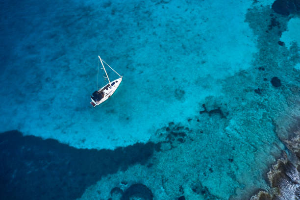 istock Anchored sailboat, view from drone 1127362341