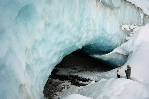 istock Couple visiting a majestic ice cave 1127362431