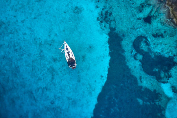 istock Anchored sailboat, view from drone 1127362443