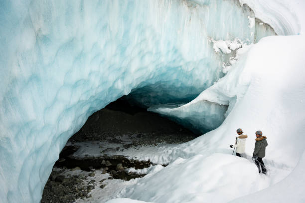 istock Couple visiting a majestic ice cave 1127362454