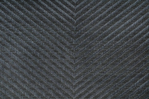 istock Closeup black color fabric texture. Dark grey fabric Herringbone pattern. design or upholstery abstract background. 1127367511