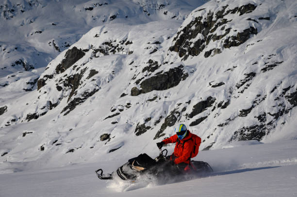 istock Snowmobiling fresh powder in the mountains 1127370323