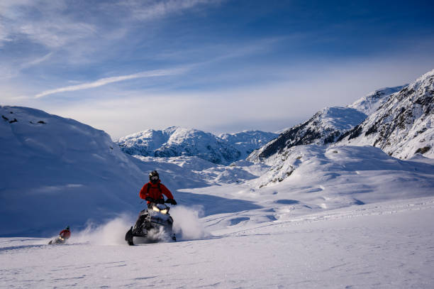 istock Snowmobiling fresh powder in the mountains 1127370327