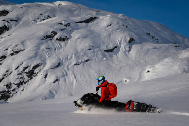 istock Snowmobiling fresh powder in the mountains 1127370331