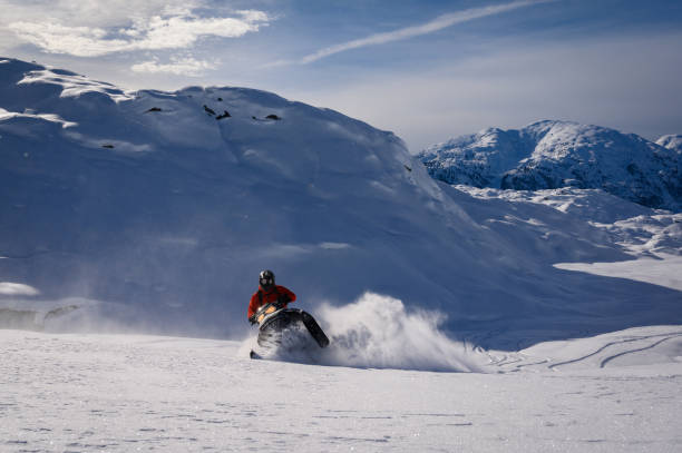 istock Snowmobiling fresh powder in the mountains 1127370332