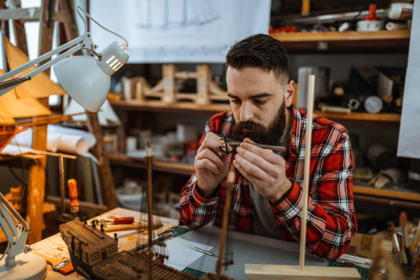 istock Adjusting parts of model ship 1127372550
