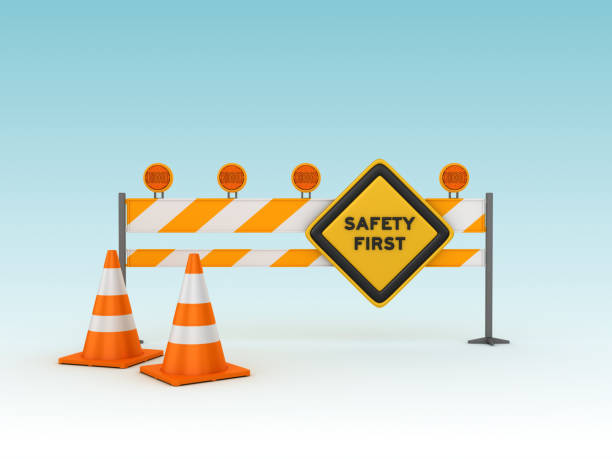 SAFETY FIRST Road Sign with Barrier and Cones - 3D Rendering SAFETY FIRST Road Sign with Barrier and Cones - Blue Background - 3D Rendering safety first at work stock pictures, royalty-free photos & images