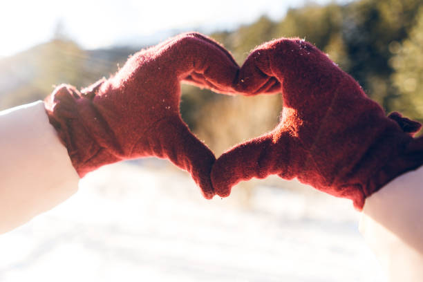 istock Showing heart to snowy mountain 1127375428