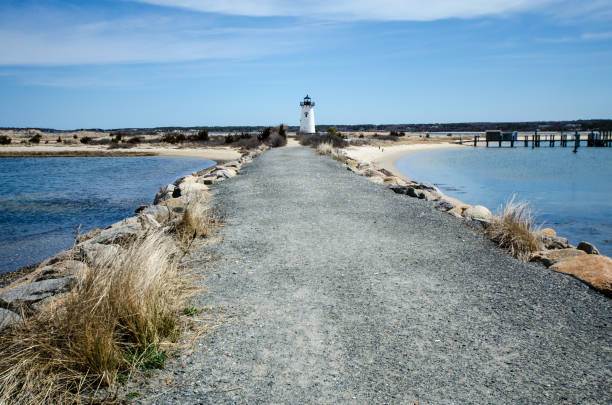 edgartown lighthouse, on martha's vineyard in massachusetts - wide angle view. - lighthouse massachusetts beach coastline imagens e fotografias de stock